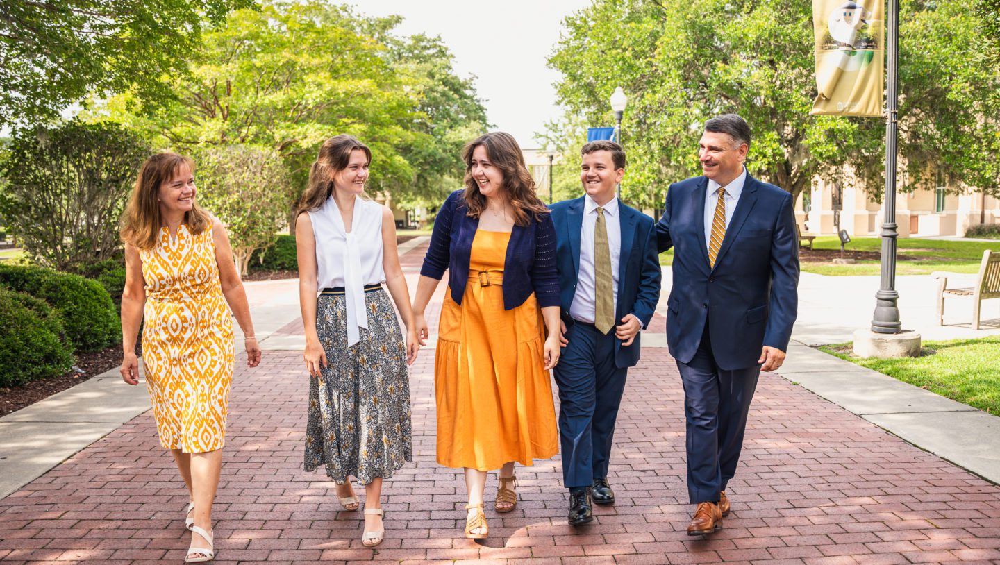 The family of the President Faulkner are walking around campus