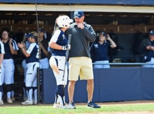 Softball coach Shane Winkler coaches a player