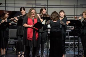 Jill Terhaar Lewis sings