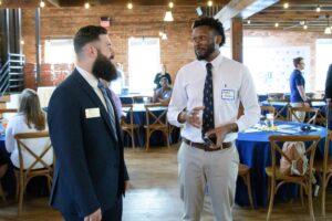 Christian Hanley speaks with attendee at CSU Comes to You
