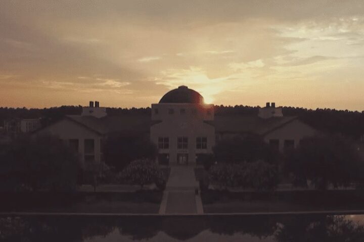 CSU's Science Building with the sun setting behind it.