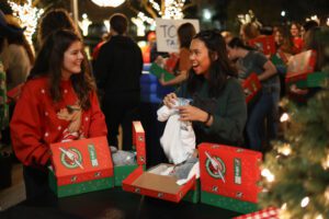 Students are filling in the boxes with different kind of toys for children