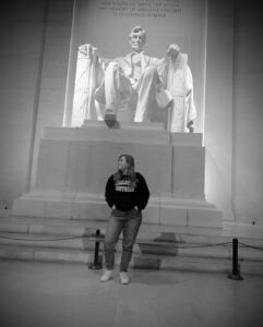 Mizner takes a picture with a statue in DC