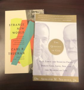 Two books, Strange New World by Carl R. Trueman (left) and The Questions of God by C.S. Lewis and Sigmund Freud (right)