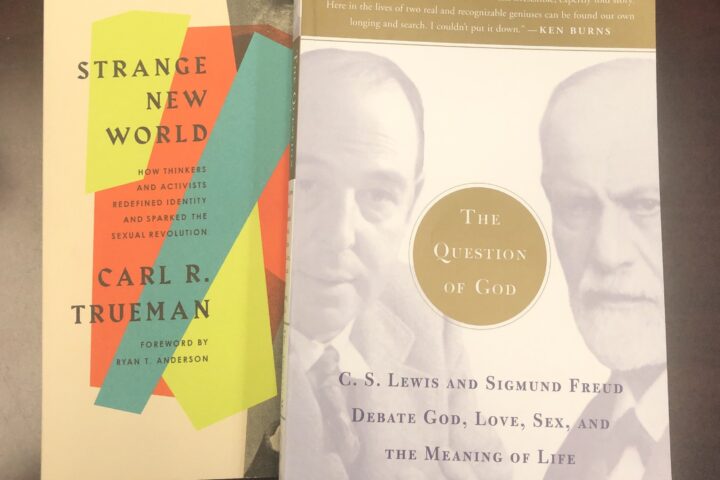 Two books, Strange New World by Carl R. Trueman (left) and The Questions of God by C.S. Lewis and Sigmund Freud (right)