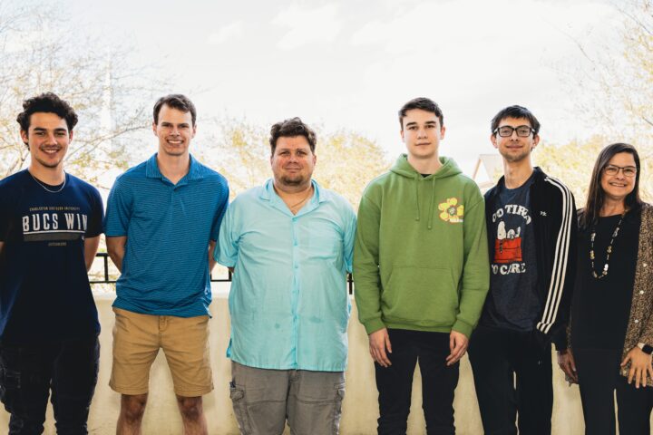 The cybersecurity team, taking a groups picture outside