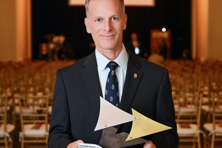 Dr. Dondi Costin with the Business of the Year trophy awarded to Charleston Southern University. Photo by Charleston Metro Chamber of Commerce.