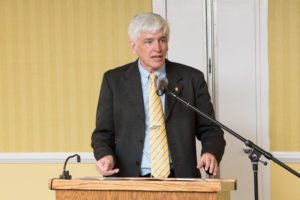 Dr. Maxwell Rollins speaking.