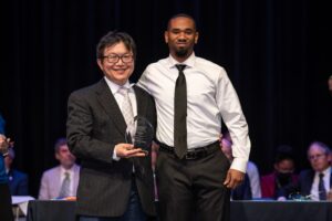 Dr. Yu-Ju Lin presents DeJean Dunbar the Outstanding Graduate in the Master of Science in computer science award at the annual Award’s Day in April. Photo by Ty Cornett