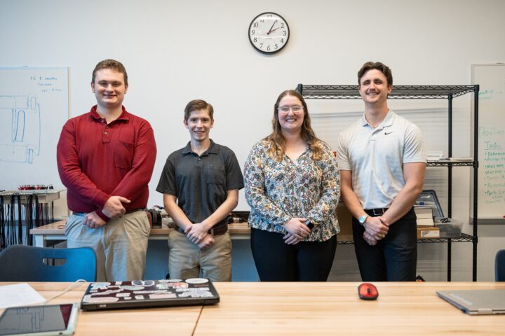Samuel Wand, Braden Siegal, Keara Walsh, and Jonathan Gaminde present their senior project robot design.