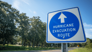 A board sign saying hurricane evacuation route