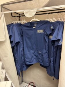 A closet with nursing shirts