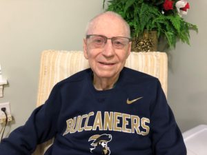 Ken Swain wearing a blue Buccaneer sweater