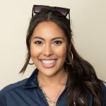 close up image of student smiling at camera