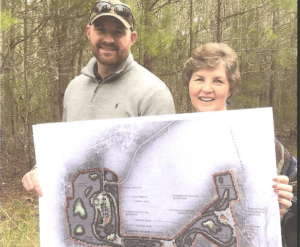 West and Poole are holding a map