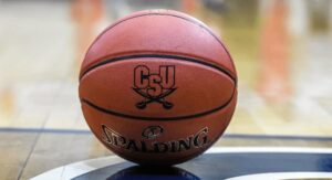 A CSU branded basketball on the basketball court