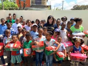 Lauriel Diel with children who received show boxes from CSU's Operation Christmas Child.