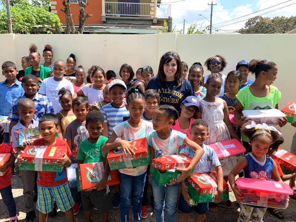 Lauriel Diel with children who received show boxes from CSU's Operation Christmas Child.